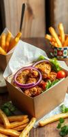 Deliciously arranged fried chicken with fresh veggies and crispy fries served in a cozy dining setting photo
