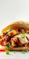 Delicious sandwich filled with crispy chicken, melted cheese, and fresh herbs prepared in a cozy kitchen environment photo