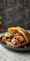 Tasty flatbread filled with spiced meat, fresh toppings, and savory sauce served on a dark table photo