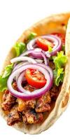 Delicious pita filled with grilled meat, fresh vegetables, and savory toppings served on a white background photo