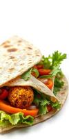 Fresh vegetable wrap with flavorful falafel and herbs ready for a healthy meal photo