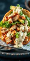 Delicious chicken salad wrap featuring fresh greens and creamy dressing served on a rustic table photo