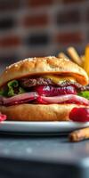 Delicious burger with fresh toppings served on a plate alongside golden fries in a cozy restaurant photo