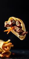 Savory pita sandwich filled with tender beef and fresh vegetables against a dark background photo