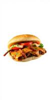 Savory cheeseburger topped with grilled onions and fresh tomatoes served on a sesame seed bun photo