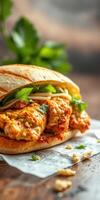 Crispy chicken sandwich with fresh herbs and vegetables on a rustic wooden table photo
