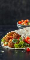 Delicious falafel wrap with fresh vegetables and salsa in a cozy dining setting photo