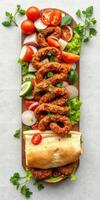 Freshly prepared dish featuring spiced meat rolls garnished with vibrant vegetables and served with flatbread photo