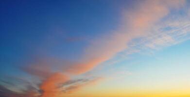 blue sky with gentle clouds at sunset in summer photo