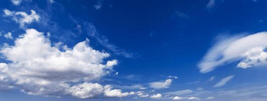 panorama with white clouds in a blue sky. Background with copy space photo