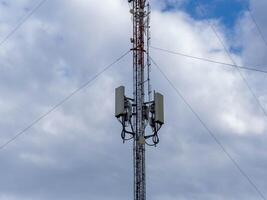 Telephone antenna telecommunication network on the sky background. Technology communication network photo