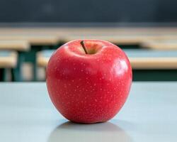 Bright red apple on a table photo