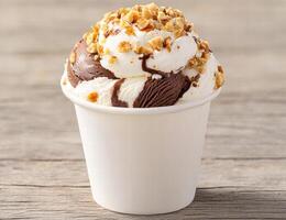 Delicious ice cream sundae with chocolate and nuts photo