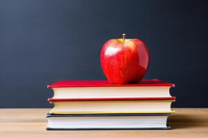 Red apple on stack of books photo