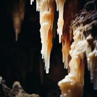 Icicles hanging from a cave ceiling photo