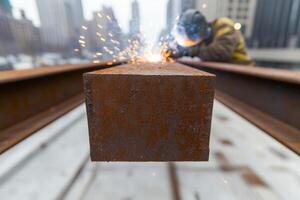sparks flying from welding metal in industrial setting photo