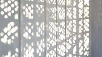 Light through lattice creating sharp patterns, contrast and simplicity. Light shadow 3d pattern photo