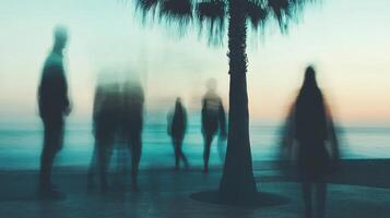 Silhouettes among palms at sunset, peaceful and timeless beach scene. Blurred view sandy beach palms photo