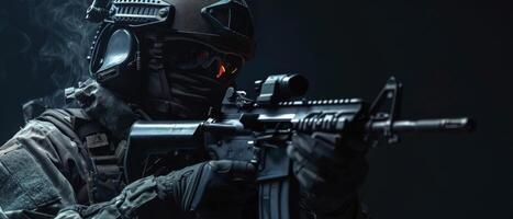 A soldier in full combat gear is aiming his rifle. photo