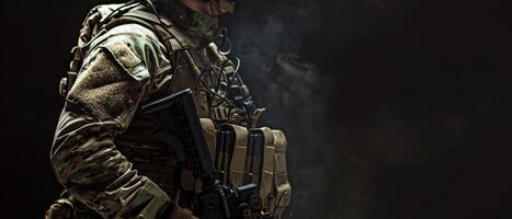 A soldier in full combat gear stands in the shadows, his face obscured by the smoke from his gun. photo