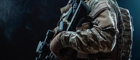 A soldier in full combat gear is silhouetted against a dark background. photo