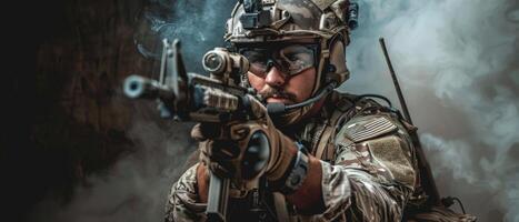 A soldier wearing a helmet and body armor is aiming an assault rifle. photo