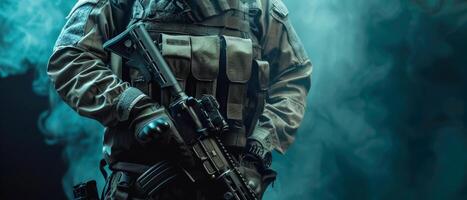 A soldier in full tactical gear is standing in a dark room. photo