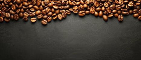 Coffee beans scattered on a dark background. photo