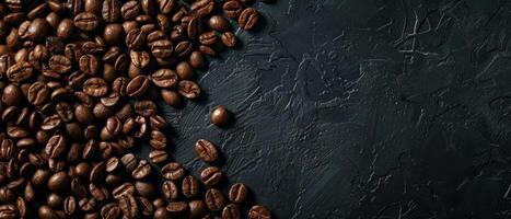 Coffee beans scattered on a dark background. photo