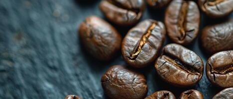 Close up of coffee beans on a dark background. photo