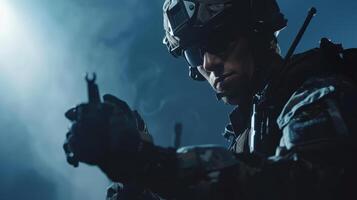 A soldier in full combat gear is holding a gun and pointing it at the viewer. photo