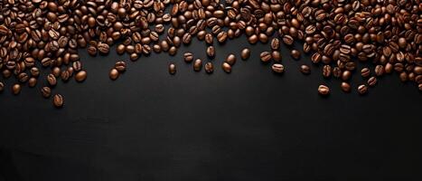 Coffee beans scattered on a black background. photo