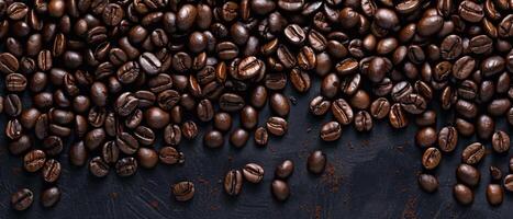 scattered coffee beans on a dark background photo