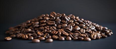 A pile of coffee beans on a black background. photo