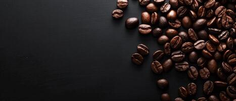 Coffee beans scattered on a black background. photo