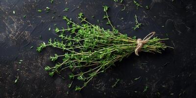 Bundle of fresh thyme sprigs, spread out on a dark, textured background, photographed from above, photorealistic photo