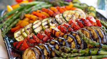 Platter of roasted vegetables including bell peppers zucchini eggplant asparagus drizzled with balsamic glaze, photorealistic photo