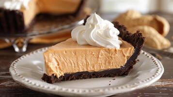 A decadent peanut butter pie with a creamy peanut butter filling and a chocolate cookie crust topped with whipped cream, photography photo