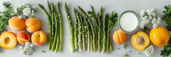 Top view table with asparagus, apricots, nectarines, and milk, white space in the middle, minimalistic, photo