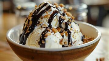 Rich creamy sugar-free vanilla ice cream sundae topped with chopped nuts and dark chocolate syrup, picture photo