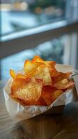Packet of snacks on a clean, bright table, photorealistic photo