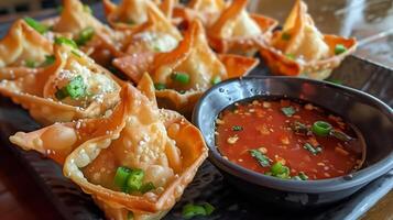 Fusion appetizer platter with crispy wontons stuffed with goat cheese and jalapenos served with sweet chili sauce, photorealistic photo