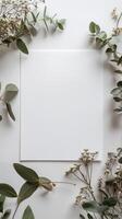 Empty white DIN A4 sheet lying alone on a white desk, photo