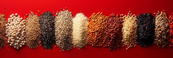 Top view of different grains on bright saturated red background, no shadows, rule of thirds, photo