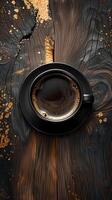 Top view of a black coffee cup on polished dark brown tile wood, picture photo