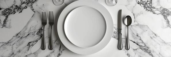 White circle paper mockup on a clean white marble table with a wine glass, knife, and fork, picture photo