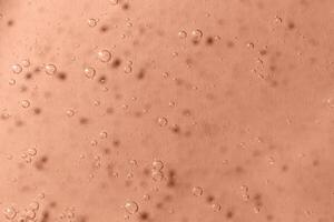Light Mocha brown textured background with bubbles close up photo