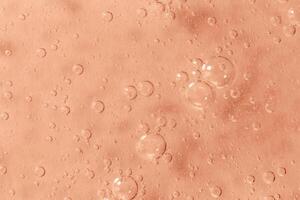 Mocha brown textured gel background with bubbles close up. Concept of cosmetic, medical and other laboratory research. Selective focus. Demonstrating color of 2025 year photo