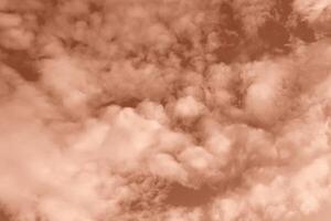 Fluffy clouds on Mocha brown sky photo