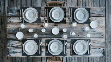 A table set with white plates and silverware photo